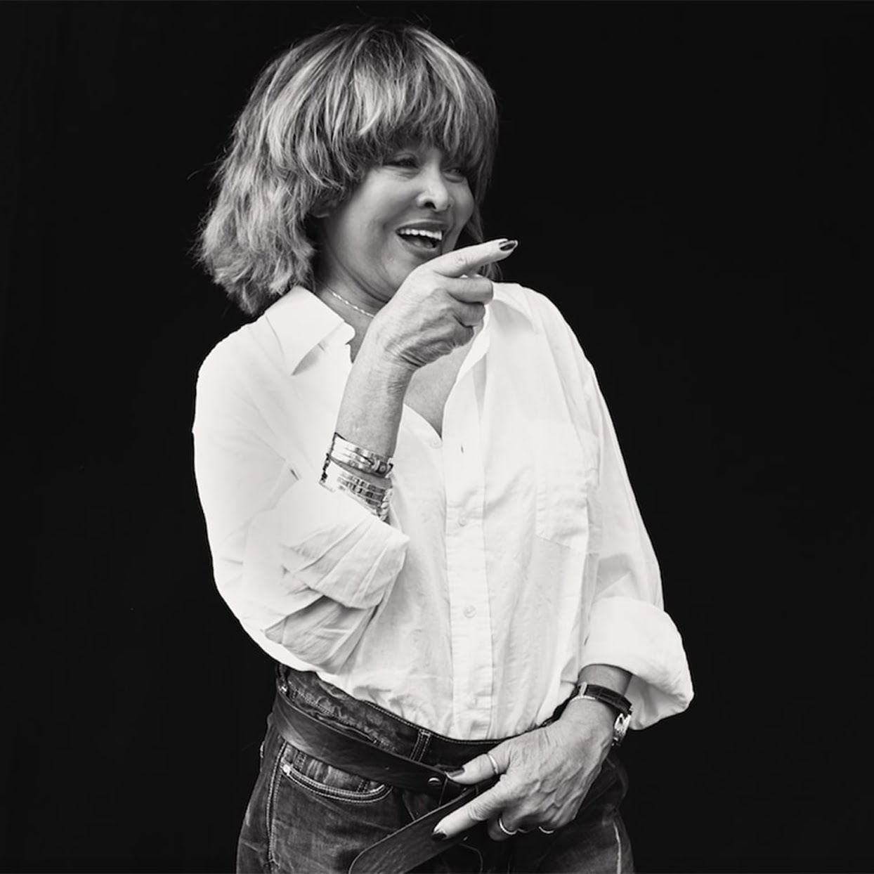 Black and white portrait of Tina Turner smiling