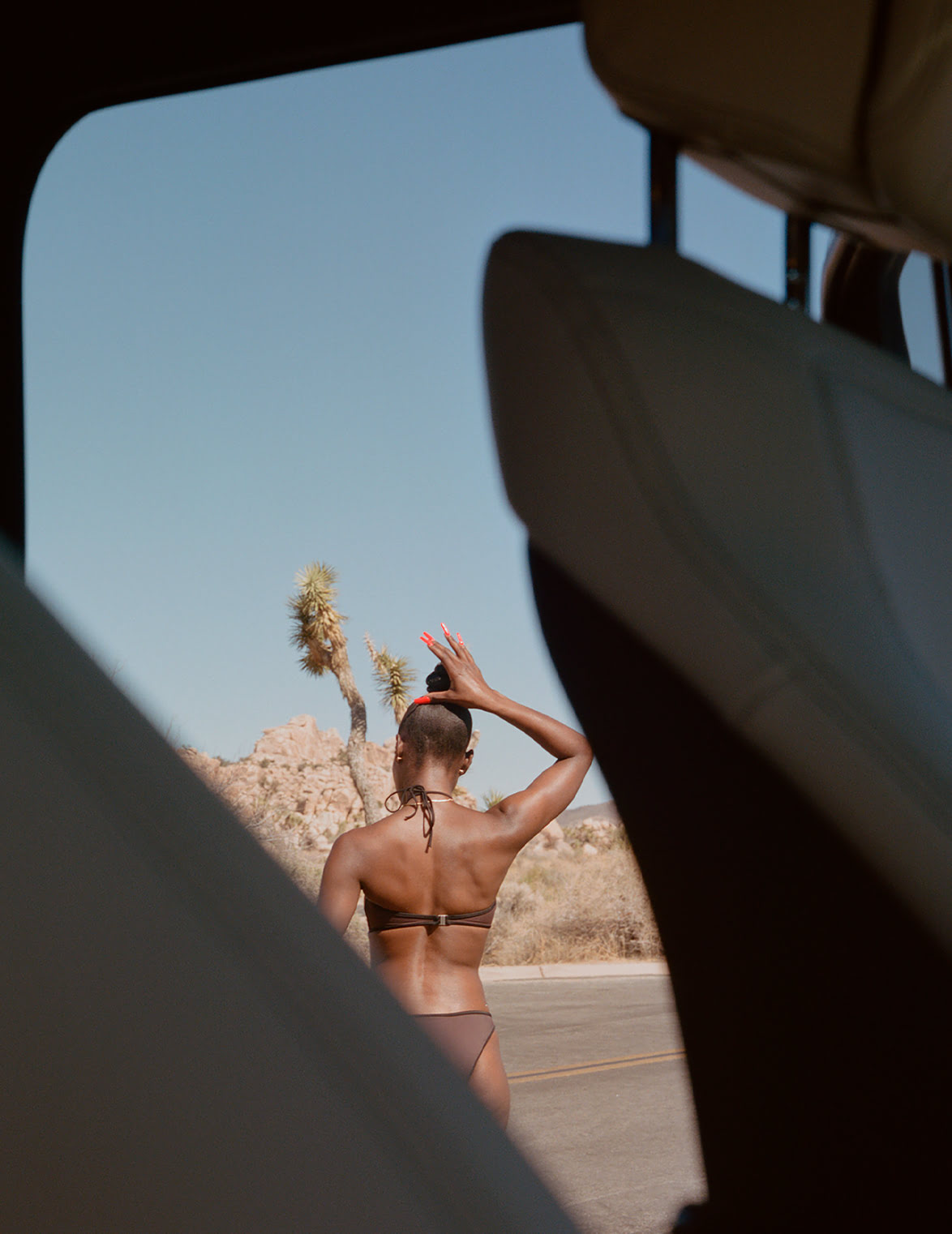 Picture of Alicia Keys in the desert next to Mercedes-Benz.